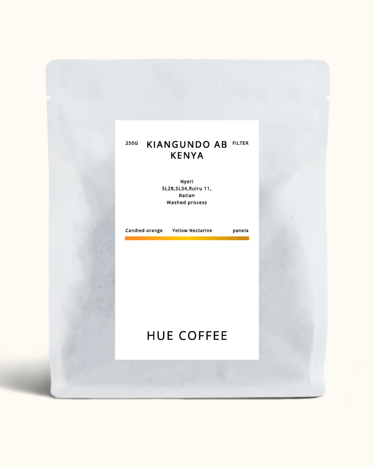 A matte white coffee pouch with a centered white label reading 'KIANGUNDO AB KENYA' and 'HUE COFFEE', photographed on a clean off-white background.